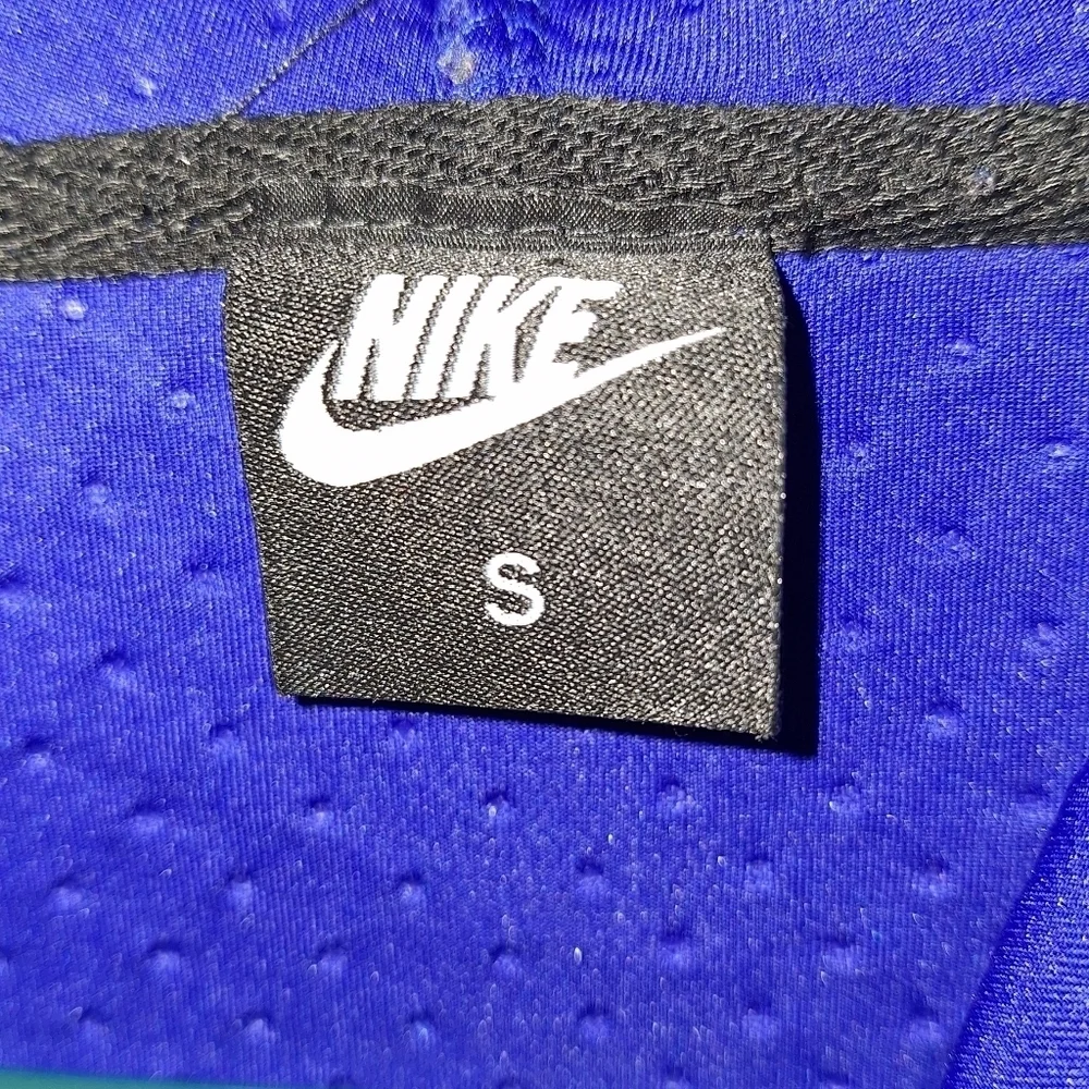 A Nike hooded full zip men's small jacket in blue. It's in excellent condition